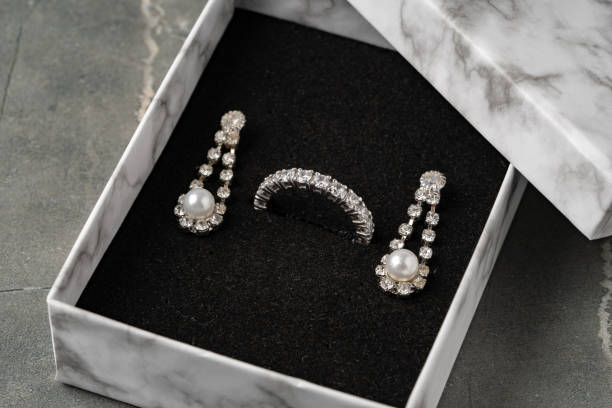 istock Golden jewellery in box on gray background 1496591523