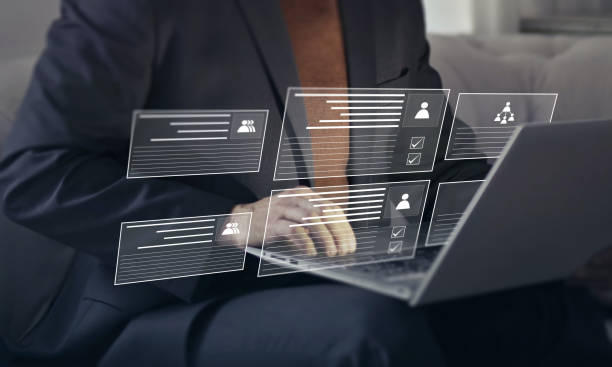 istock team work concept, businessman managing teams and their work through online portal 1496593412