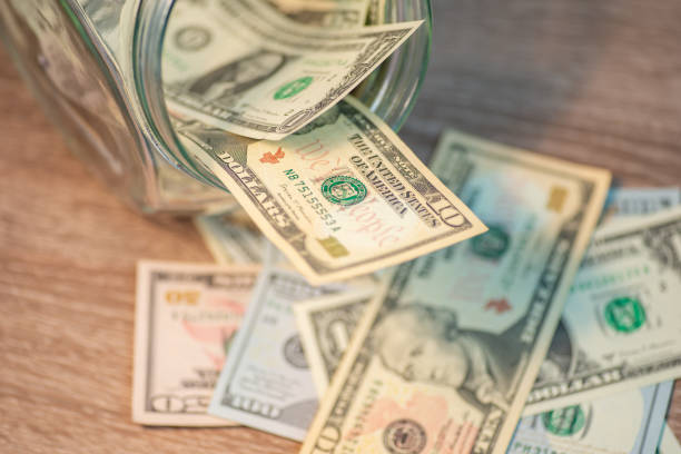 istock Dollar banknotes on the wooden table 1496595625
