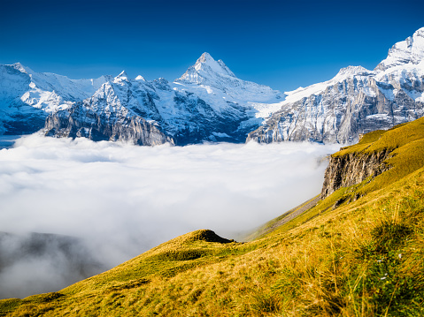 Mountain scenery in the summertime. A place for mountain hiking with a beautiful view. Mountains and landscapes in Europe. Landscape in the daytime. Clouds in the valley.