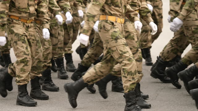 Russian Ukrainian conflict. Russia military invasion. War parade. Soldier boots.