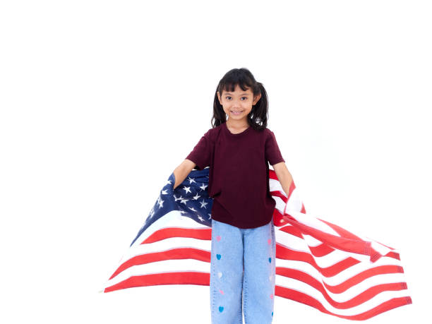 istock Little girl and American flag on white background 1496598708