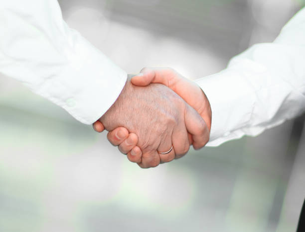istock closeup. handshake of business partners on blurred background. 1496602016