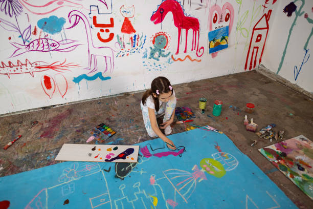 istock Young Schoolgirl Engaged in Art Class 1496602700
