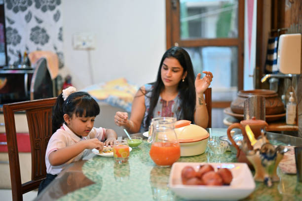 istock A mother and daughter having a delightful breakfast at the dining table 1496604284