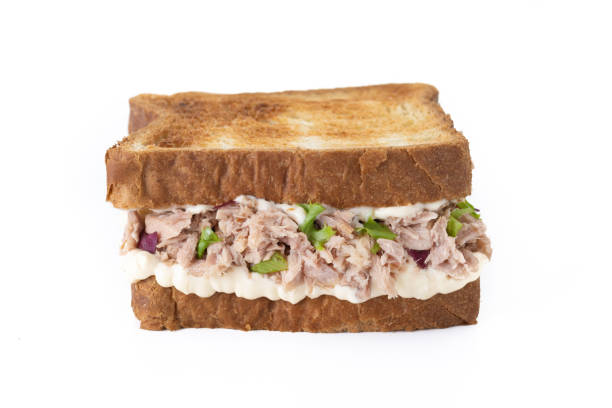 istock Tuna sandwich with mayo and vegetables isolated on white background 1496604401