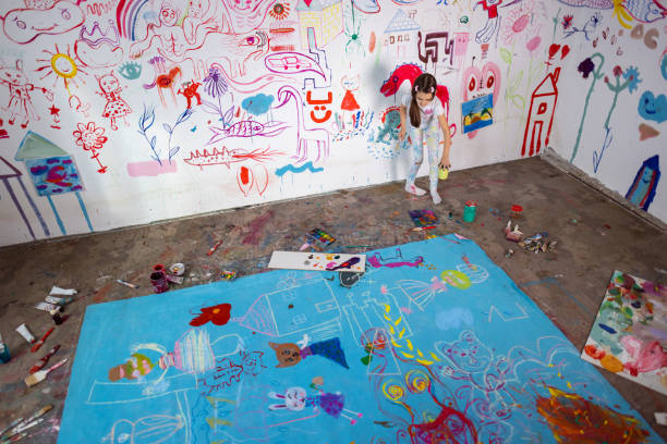 Sainte, France – March 31, 2024: A Colorful graffiti-covered building by a grassy field
