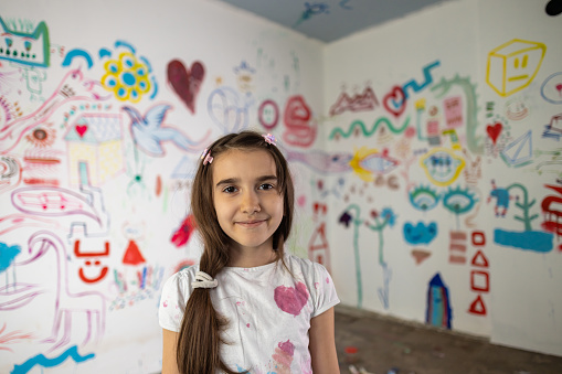 Portrait of a young school girl in the art classroom.