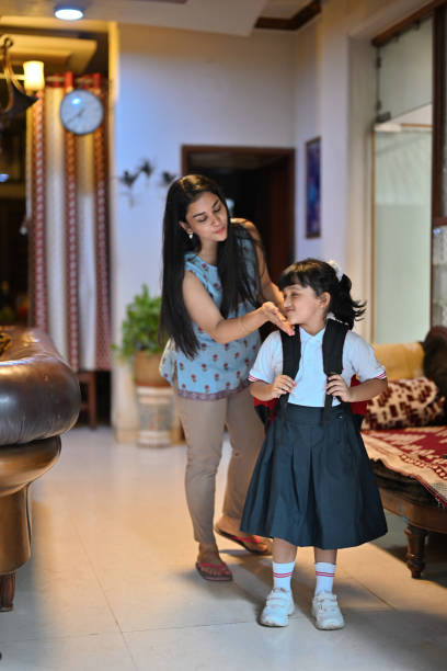 istock A caring mother escorts her daughter for school 1496605362