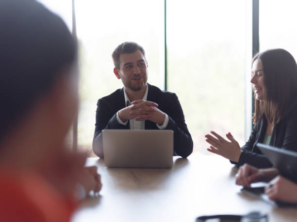 istock A diverse group of business professionals gathered at a modern office for a productive and inclusive meeting 1496611280