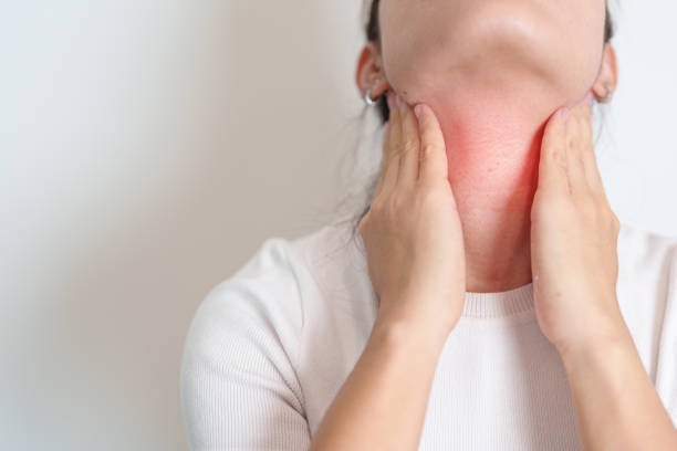 istock Woman checking Thyroid gland disease. Hand holding Neck pain. Hyperthyroidism, Hypothyroidism, Hashimoto Thyroiditis, Thyroid Tumor and Cancer, Postpartum, Papillary Carcinoma and Health concept 1496612874
