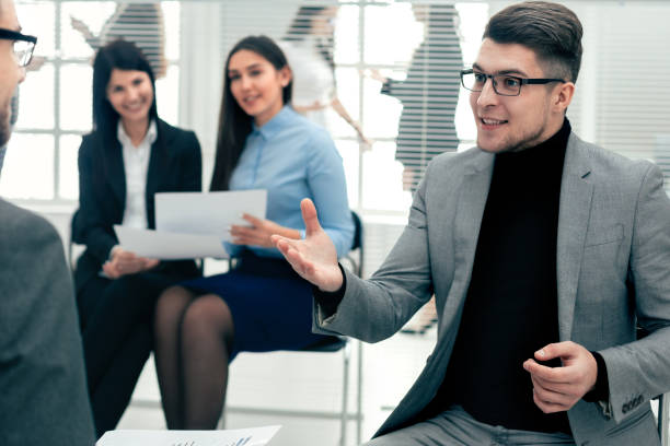 istock two employees discussing new ideas in the office 1496612882