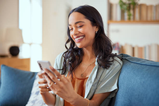 istock Cheerful multiethnic woman messaging on phone 1496614279