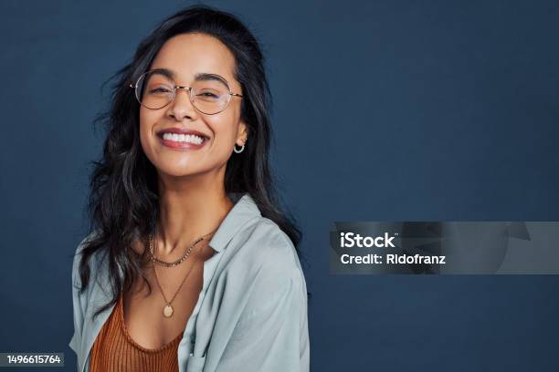 Cheerful Young Woman With Eyeglasses Smiling And Looking At Camera Stock Photo - Download Image Now