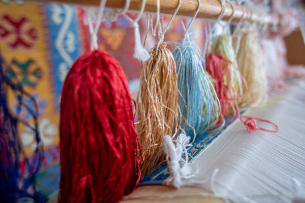 istock Turkish traditional silk production, silk thread extracting from cocoon in water. 1496616069