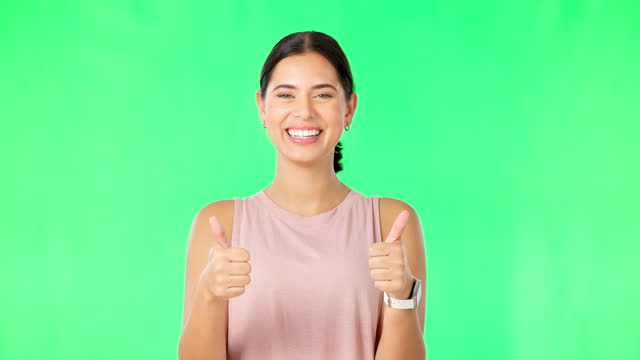 Happy woman, hands and thumbs up on green screen for fitness, agreement or winning against a studio background. Portrait of sporty female showing thumb emoji, yes sign or like for good job on mockup