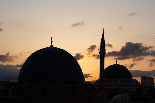 Silhouette of the Al-Jazzar or White Mosque at twilight in Acre, Israel.