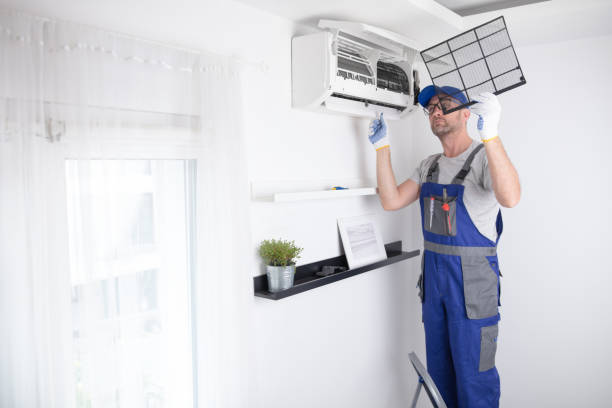 istock Service guy cleaning and maintaining air condition unit. 1496620735