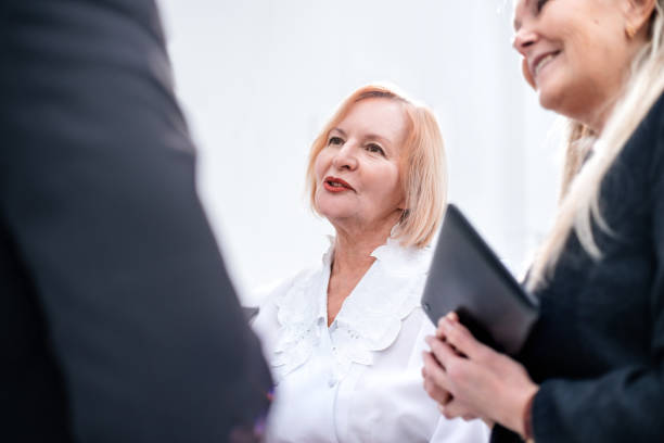 istock close up. group of employees standing in the office 1496620812