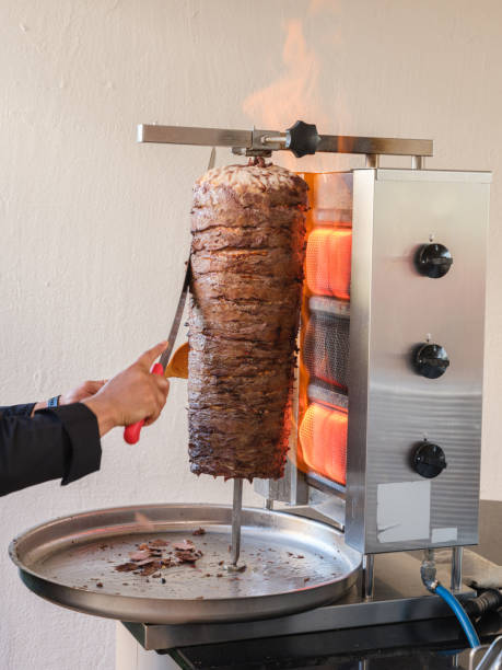 istock chef cooking traditional Turkish doner kebab at a celebration 1496623085