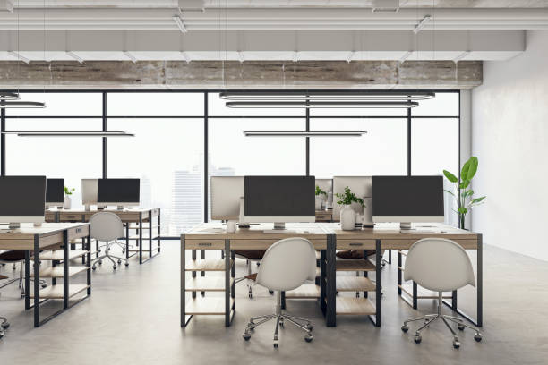 istock Front view of modern office interior with big window and desks with computers. 3D Rendering 1496626070