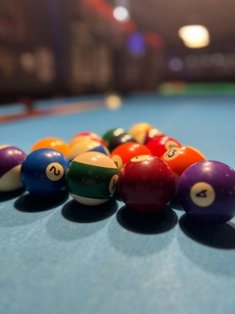 istock Vertical closeup of bowling balls arranged in a triangle 1496628384