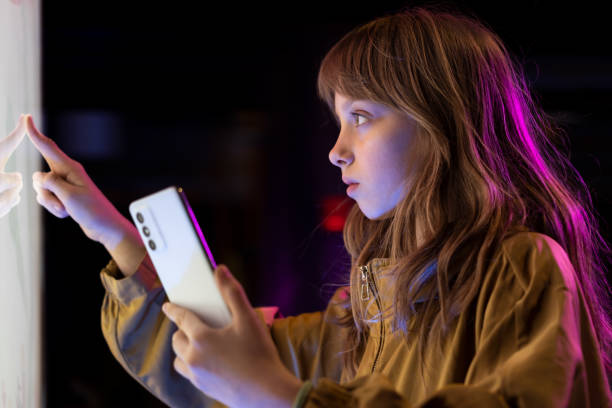 istock Little girl with smart phone 1496630648
