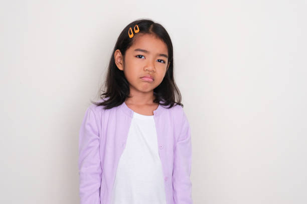 istock Asian little girl looking camera with lazy expression 1496630928