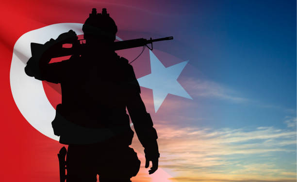 istock Silhouette of soldier with Turkey flag on background of sky 1496634949