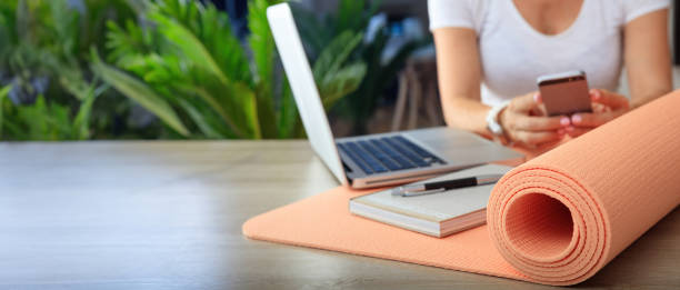 istock Woman and an exercise mat in an office background 1496637291