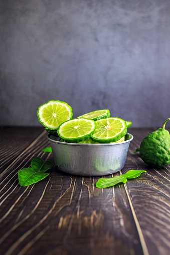 Fresh green bergamot fruit, slices of bergamot