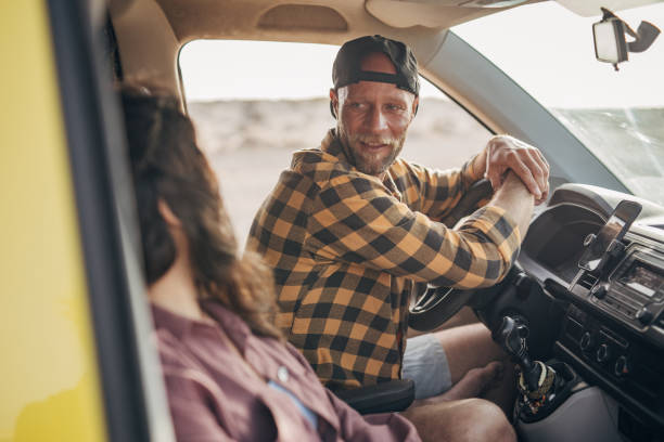 istock Couple on the road trip at the car 1496637982
