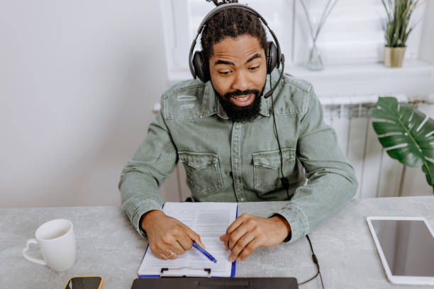 istock Dynamic African American Businessman Conducts Video Call in Office 1496639678