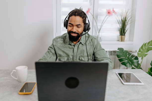 istock African American Businessman Thrives in Office Video Call 1496639708