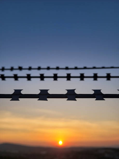 Barbed wire area Barbed wire area barbed wire wire factory sky stock pictures, royalty-free photos & images