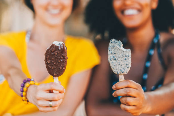istock Friends on beach holiday eating ice cream 1496641658