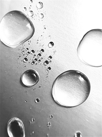 Water droplets on white surface