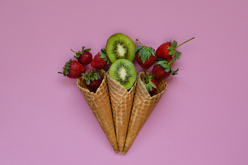 Fresh fruits in ice cream cones