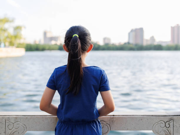istock Little Girl by the Lake 1496646193
