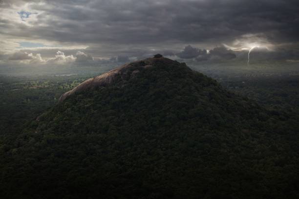 istock the view of a very large green mountain surrounded by clouds 1496646675