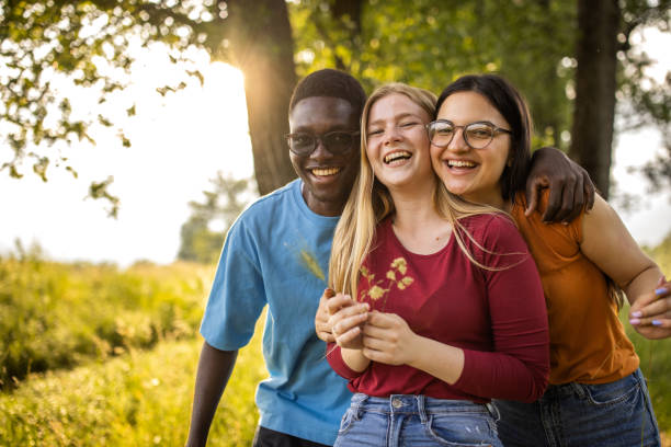 istock Young friends walking in the woods 1496647034