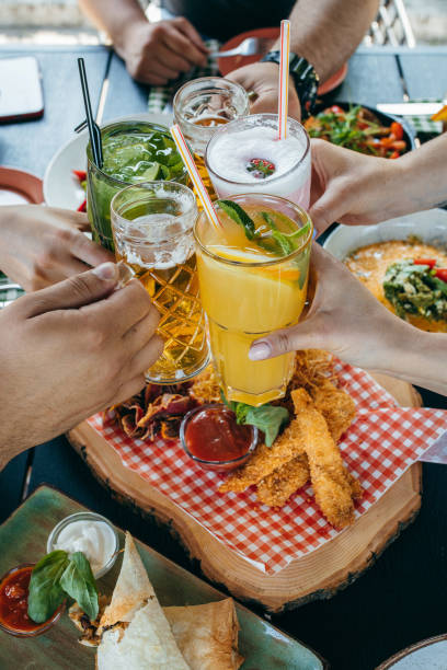 istock Group of people eating and drinking in cafe 1496647191