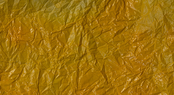 Yellow crumpled paper background.