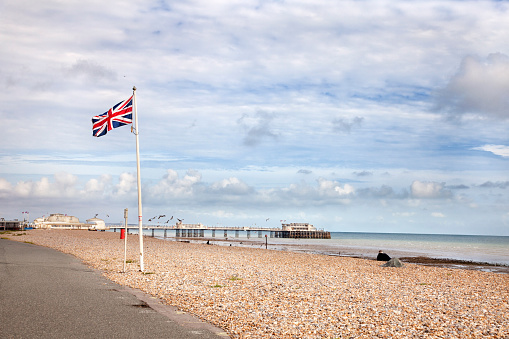 Union Jack flying at the sea front near the  Worthing pier