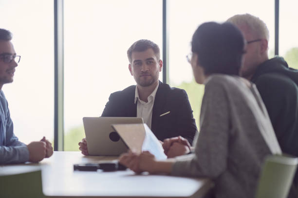 istock A diverse group of business professionals gathered at a modern office for a productive and inclusive meeting 1496657310