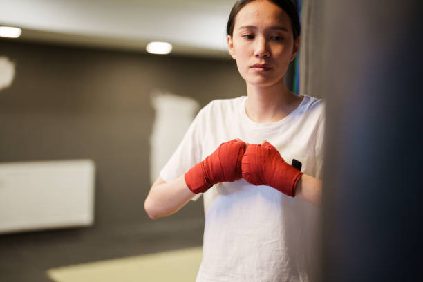 istock Female boxer training with bandage wrapped hands 1496663398