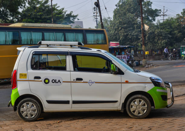Agra, India - Nov 13, 2017. Ola car on street in Agra, India. Agra is included on the Golden Triangle tourist circuit, along with Delhi and Jaipur.