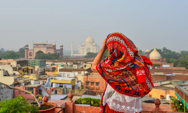 istock A young woman looking at Taj Mahal 1496669633