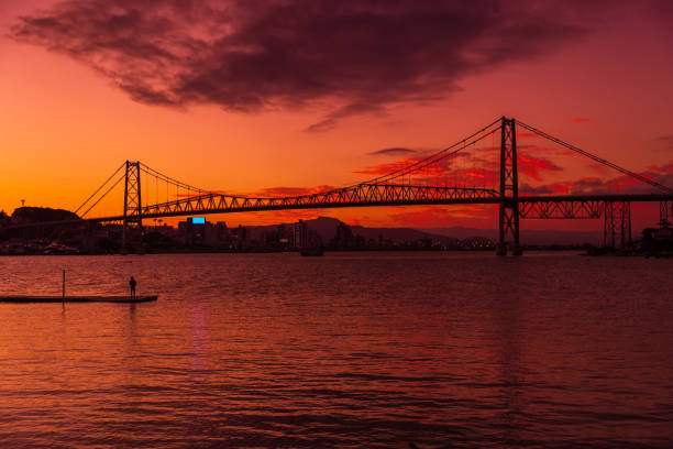 Hercilio luz old bridge and warm sunset with colorful sky in Florianopolis