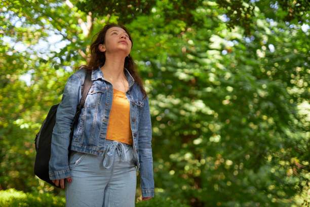 istock young girl enjoying nature 1496670098